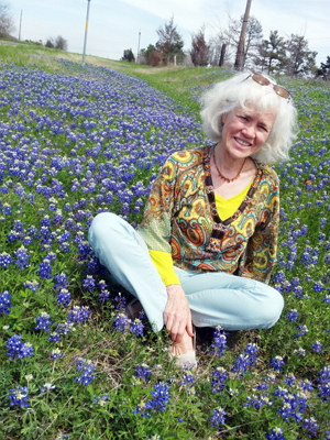 Anne Sermons Gillis sitting in Texas Bluebonnets